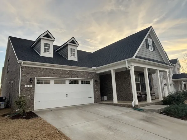 front view of a house with a yard