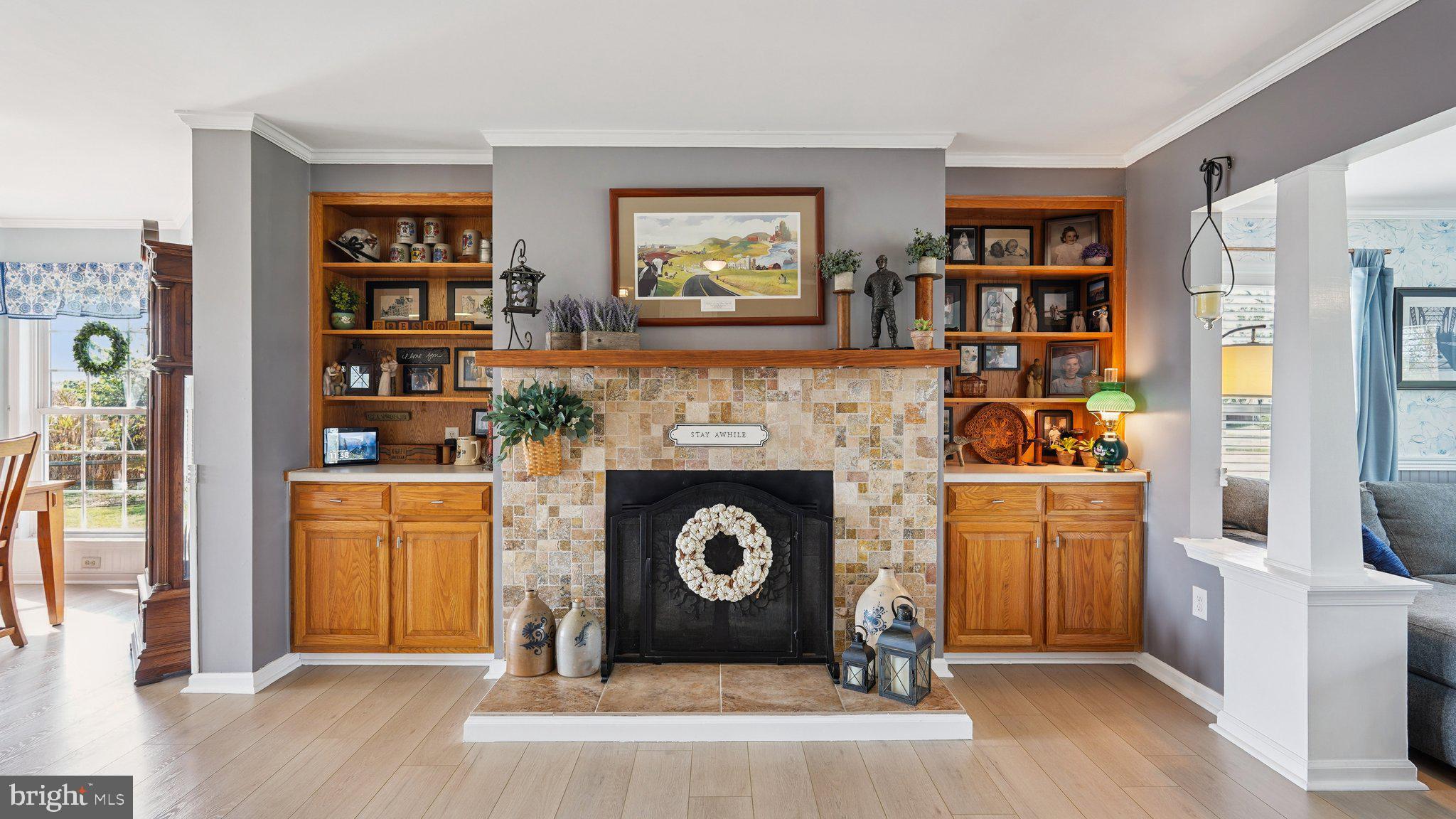 4387 Coles Point Road Hague, VA 22469 - Photo 12 of 39 a living room with hard wood floors and a fireplace