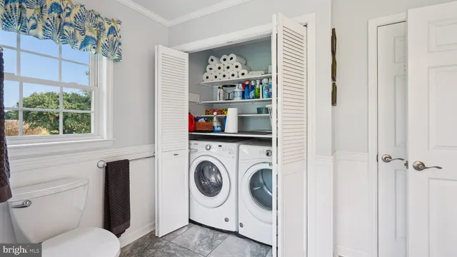 a bedroom with a bed and a bookshelf