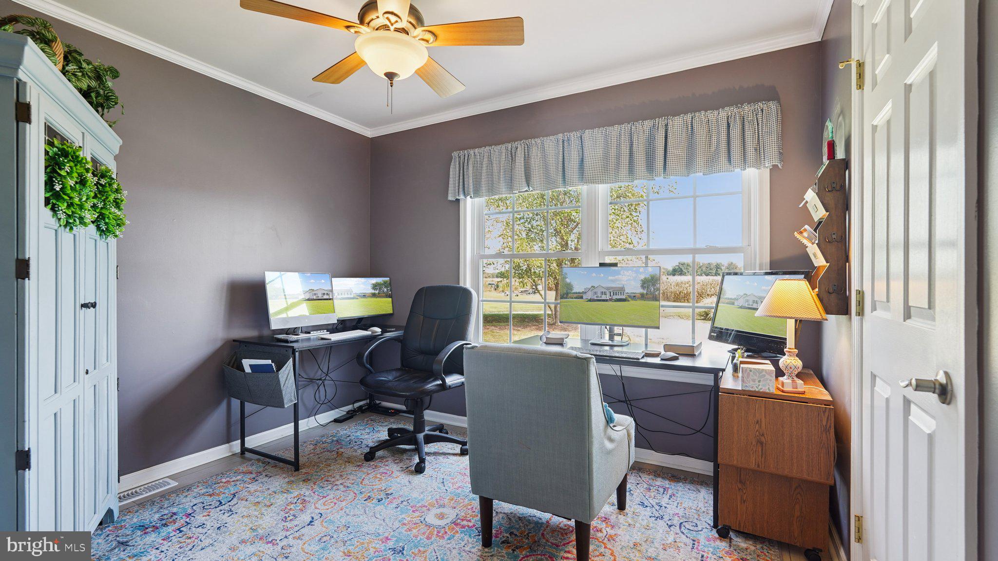 4387 Coles Point Road Hague, VA 22469 - Photo 23 of 39 a view of a workspace with furniture and a window