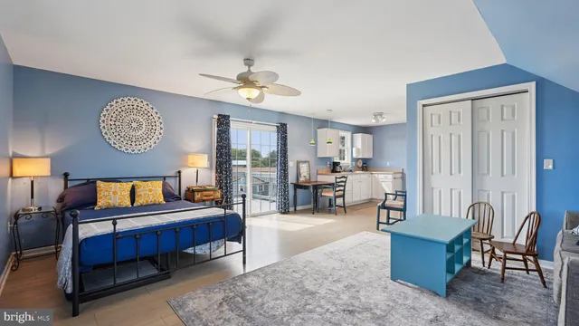 a en suite bathroom with a sink mirror and a shower