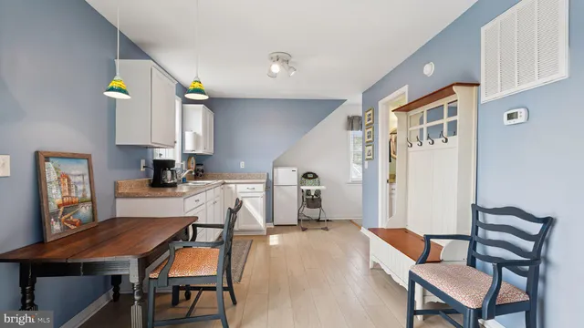 a view of a house with yard and a garden