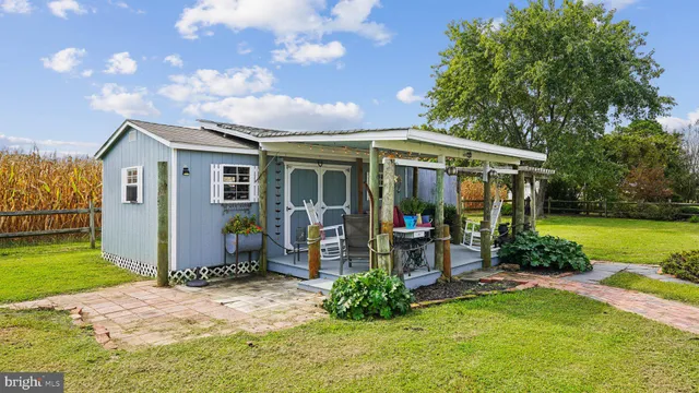 a view of a balcony with chairs and wooden floor