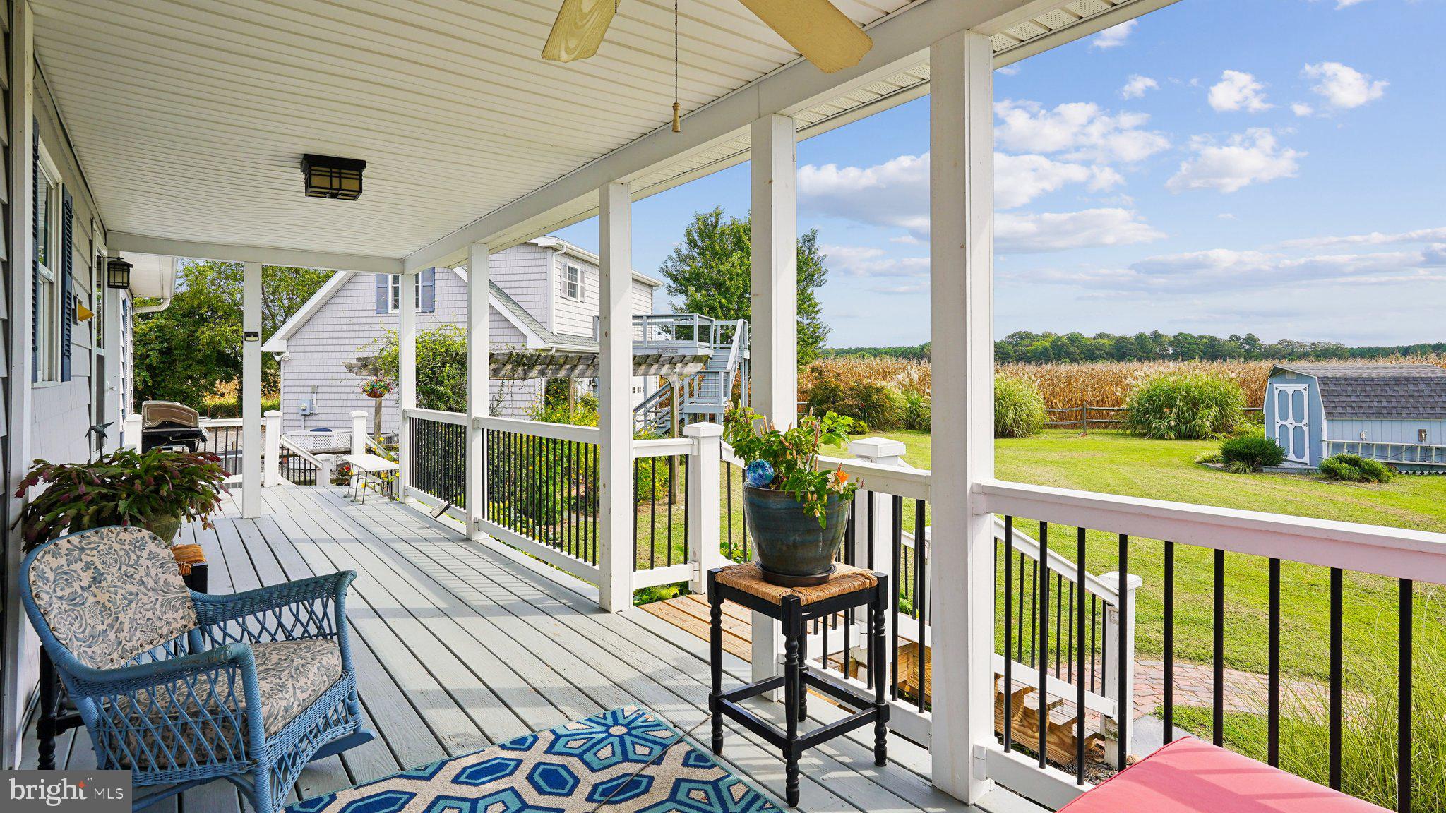 4387 Coles Point Road Hague, VA 22469 - Photo 34 of 39 a view of a balcony with chairs and wooden floor