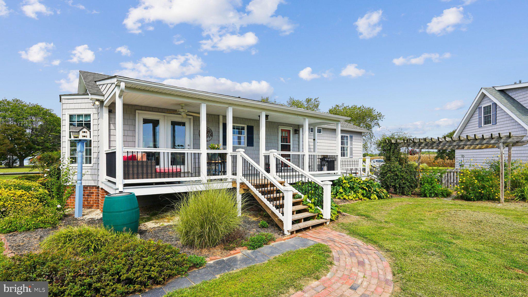 4387 Coles Point Road Hague, VA 22469 - Photo 35 of 39 a view of a house with swimming pool and sitting area
