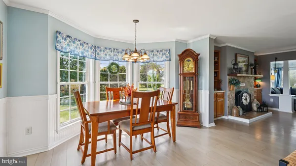 a living room with furniture a rug and a chandelier