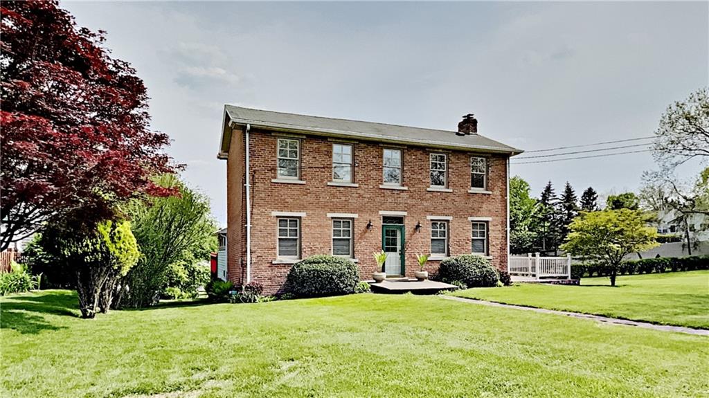 8150 Peebles Road Pittsburgh, PA 15237 - Photo 2 of 25 a front view of a house with a yard