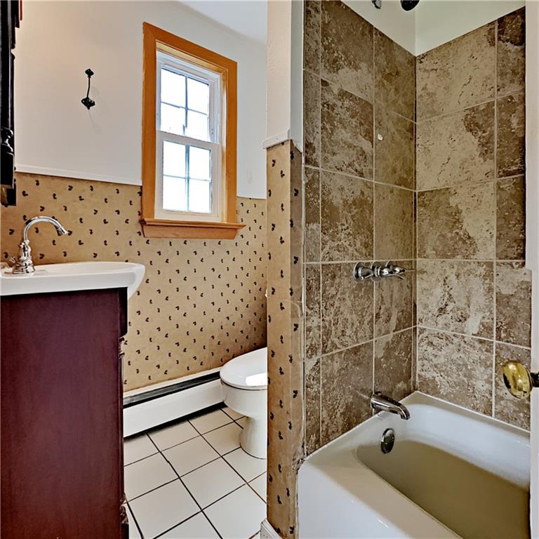 8150 Peebles Road Pittsburgh, PA 15237 - Photo 12 of 25 a bathroom with a sink a toilet and shower