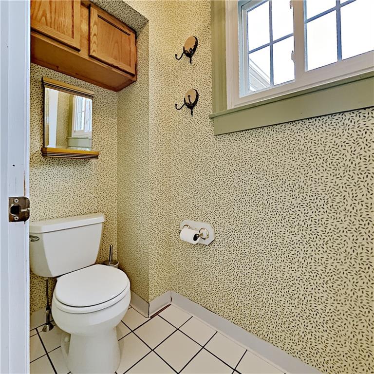 8150 Peebles Road Pittsburgh, PA 15237 - Photo 19 of 25 a bathroom with a toilet a sink and a window