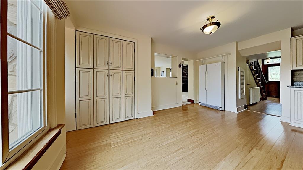 8150 Peebles Road Pittsburgh, PA 15237 - Photo 8 of 25 a view of empty room with wooden floor and fan