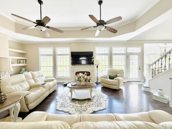a kitchen with stainless steel appliances kitchen island granite countertop a stove a sink and a microwave