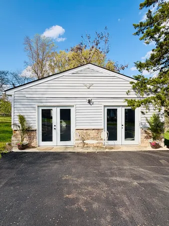 a view of a yard with a wooden fence