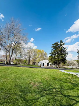 a view of a yard with an outdoor space