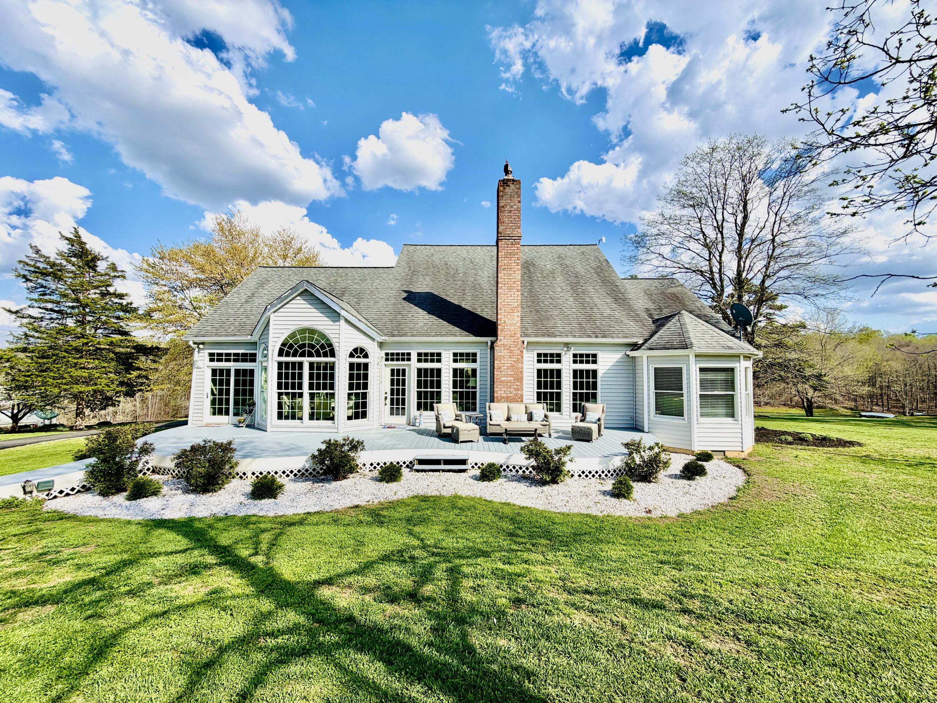 2844 Fairview Church Road Huddleston, VA 24104 - Photo 35 of 101 a front view of house with yard and trees in the background
