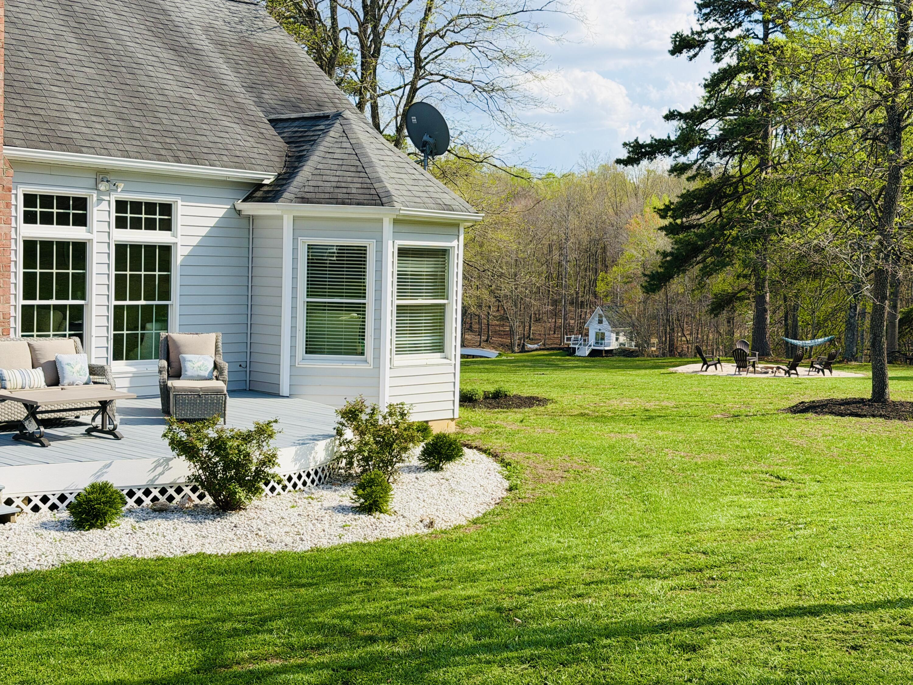 2844 Fairview Church Road Huddleston, VA 24104 - Photo 36 of 101 a front view of a house with garden and trees