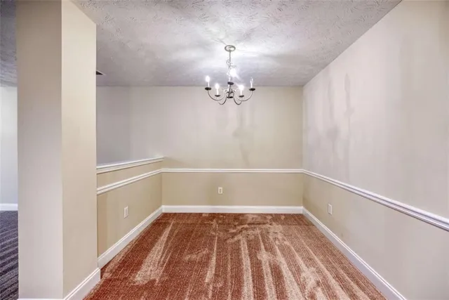 a view of a kitchen with a sink and dishwasher cabinets