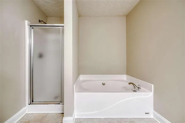 an empty room with a empty space and windows