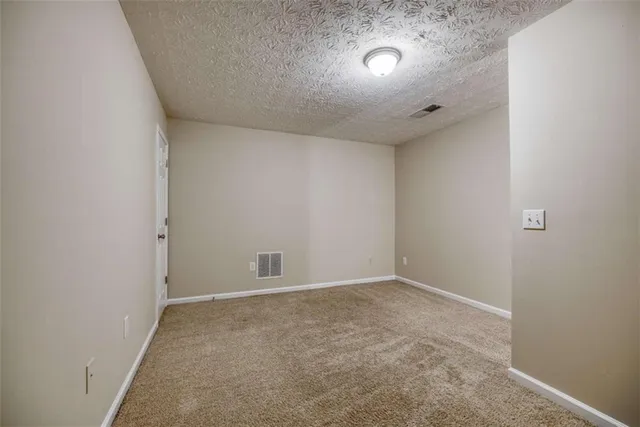 a white toilet sitting next to a bath tub