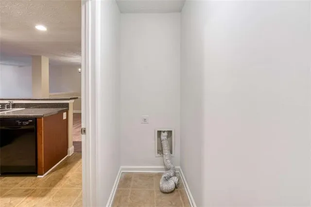 a kitchen with granite countertop a sink and a stove