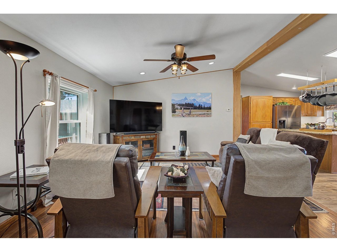 8701 Rock Hill Road Loveland, CO 80537 - Photo 11 of 50 a view of living room and kitchen with furniture