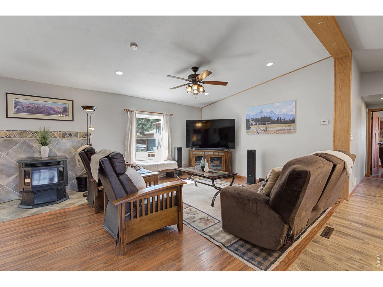 8701 Rock Hill Road Loveland, CO 80537 - Photo 13 of 50 a living room with furniture and a flat screen tv