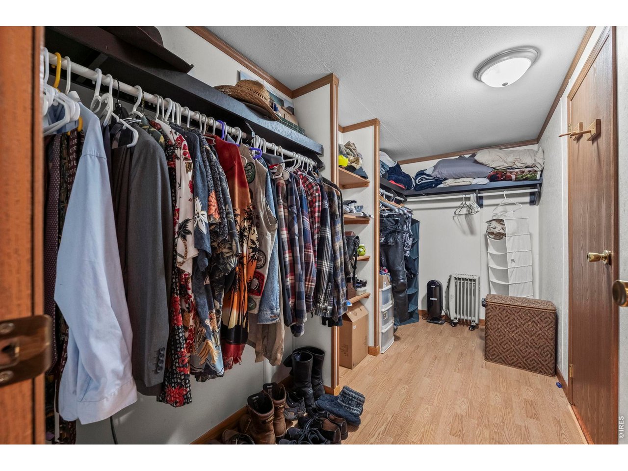 8701 Rock Hill Road Loveland, CO 80537 - Photo 24 of 50 a view of walk in closet with clothes