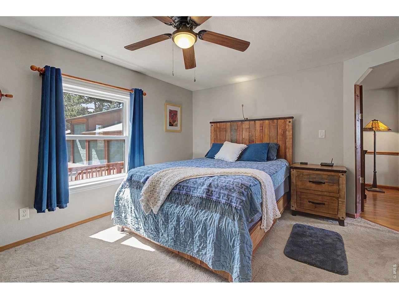 8701 Rock Hill Road Loveland, CO 80537 - Photo 27 of 50 a bedroom with a bed and a large mirror