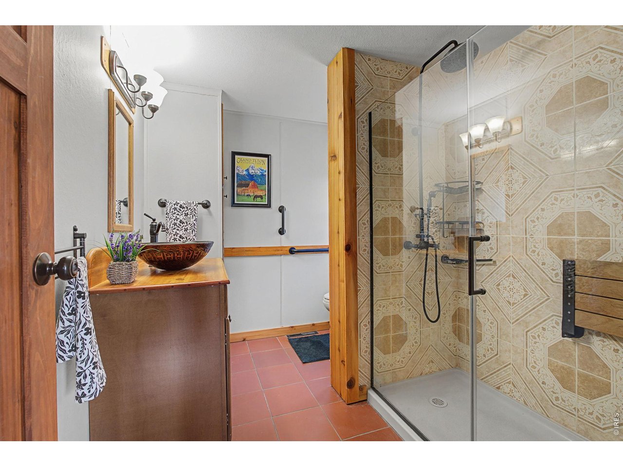 8701 Rock Hill Road Loveland, CO 80537 - Photo 28 of 50 a bathroom with a bathtub and shower