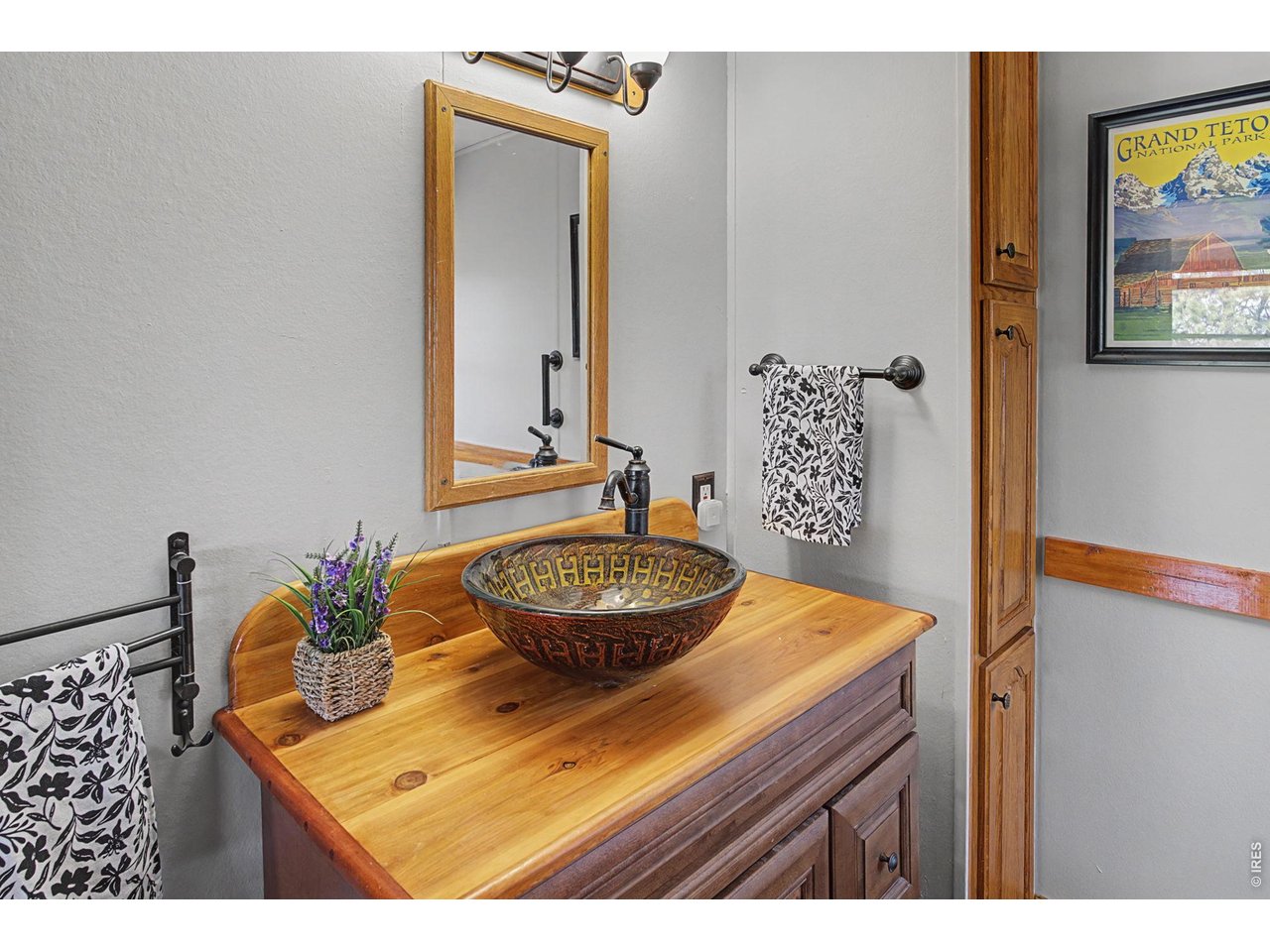 8701 Rock Hill Road Loveland, CO 80537 - Photo 29 of 50 a bathroom with a sink and a mirror