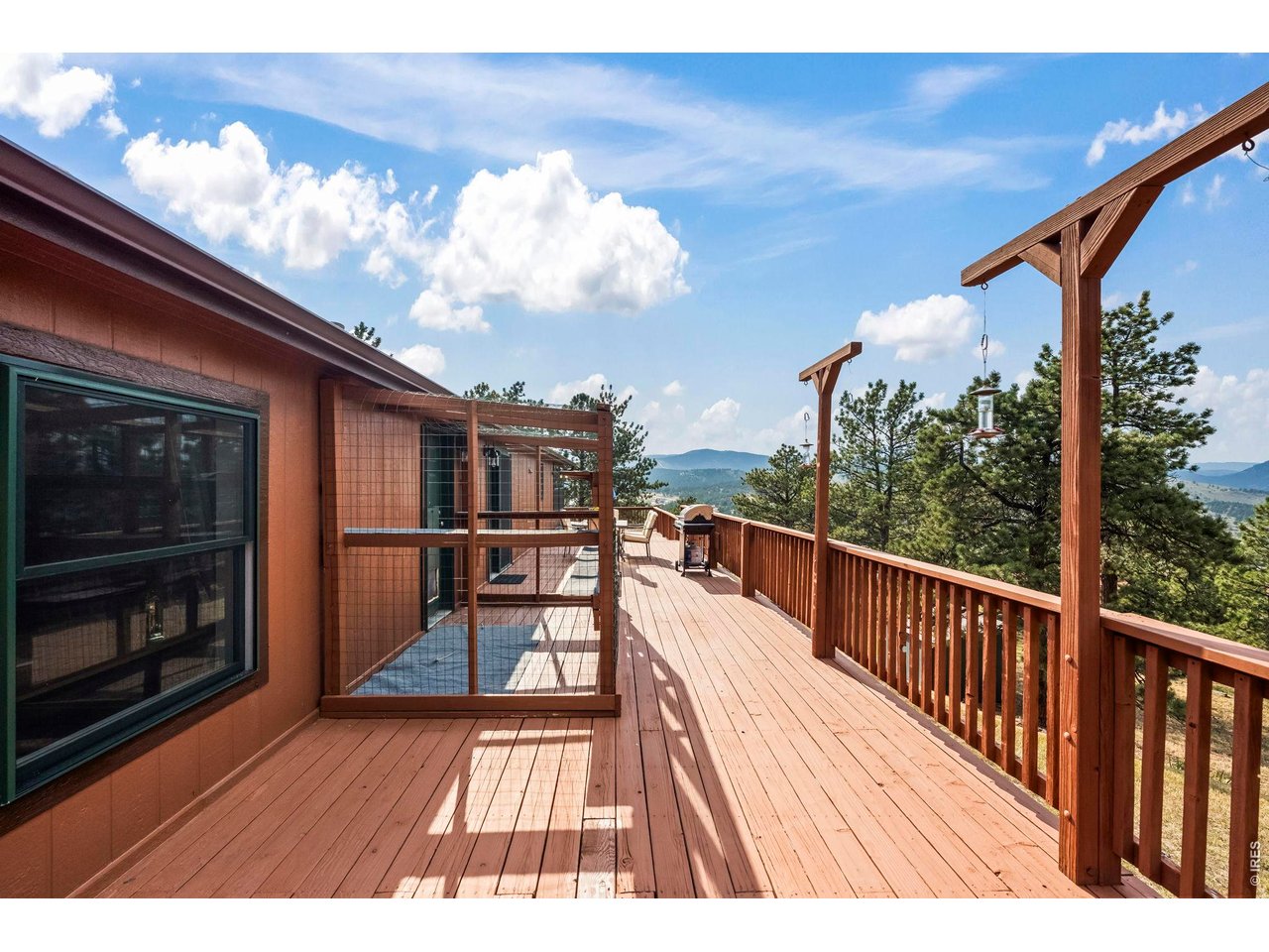 8701 Rock Hill Road Loveland, CO 80537 - Photo 32 of 50 a view of balcony with wooden floor and seating space