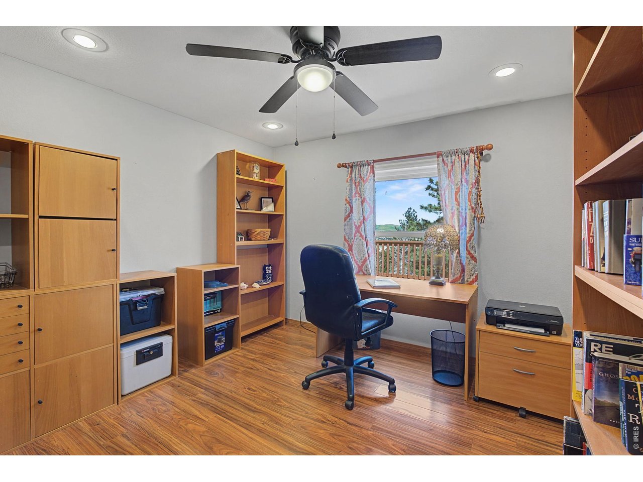 8701 Rock Hill Road Loveland, CO 80537 - Photo 33 of 50 a view of a workspace with furniture and a window