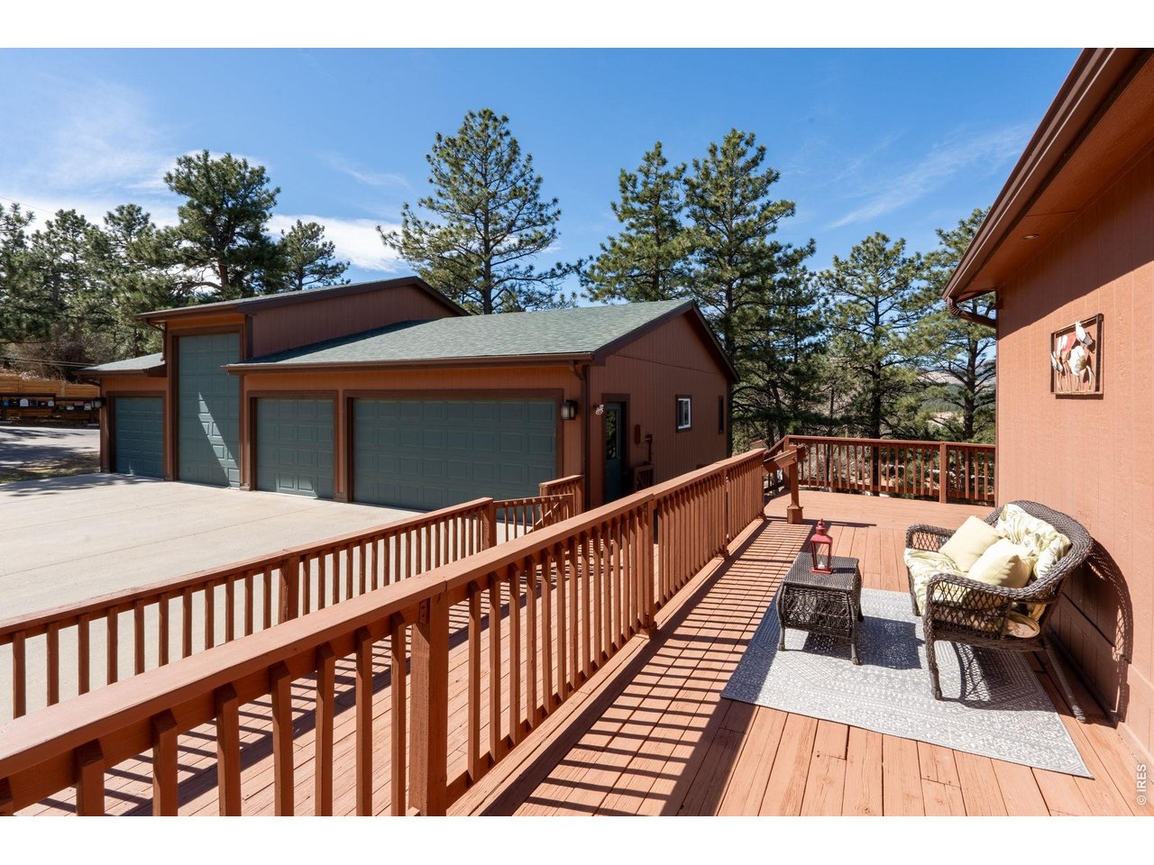 8701 Rock Hill Road Loveland, CO 80537 - Photo 4 of 50 a view of balcony with wooden floor and potted plants