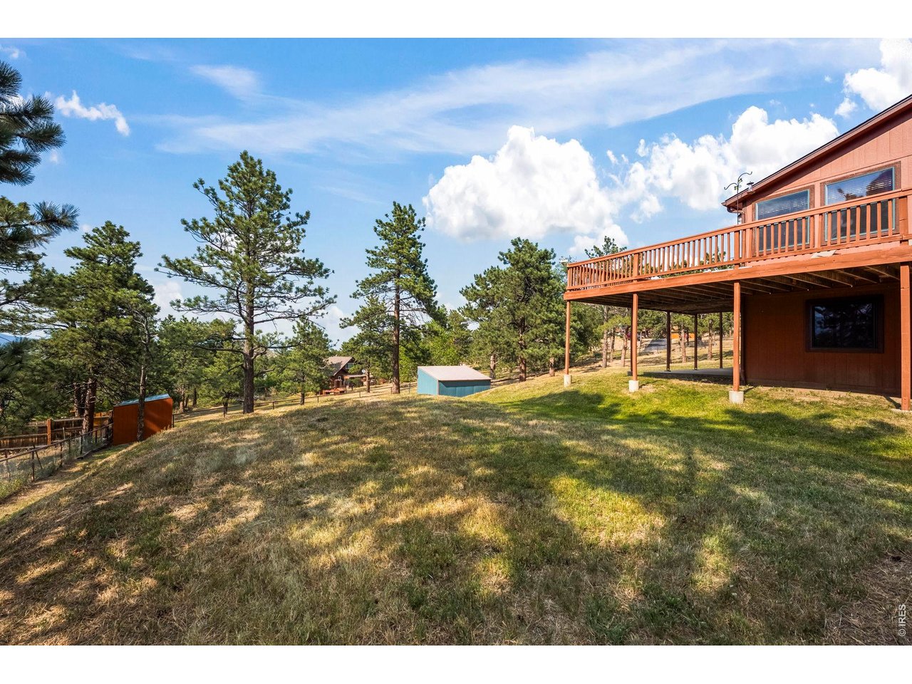 8701 Rock Hill Road Loveland, CO 80537 - Photo 46 of 50 a view of a house with a yard
