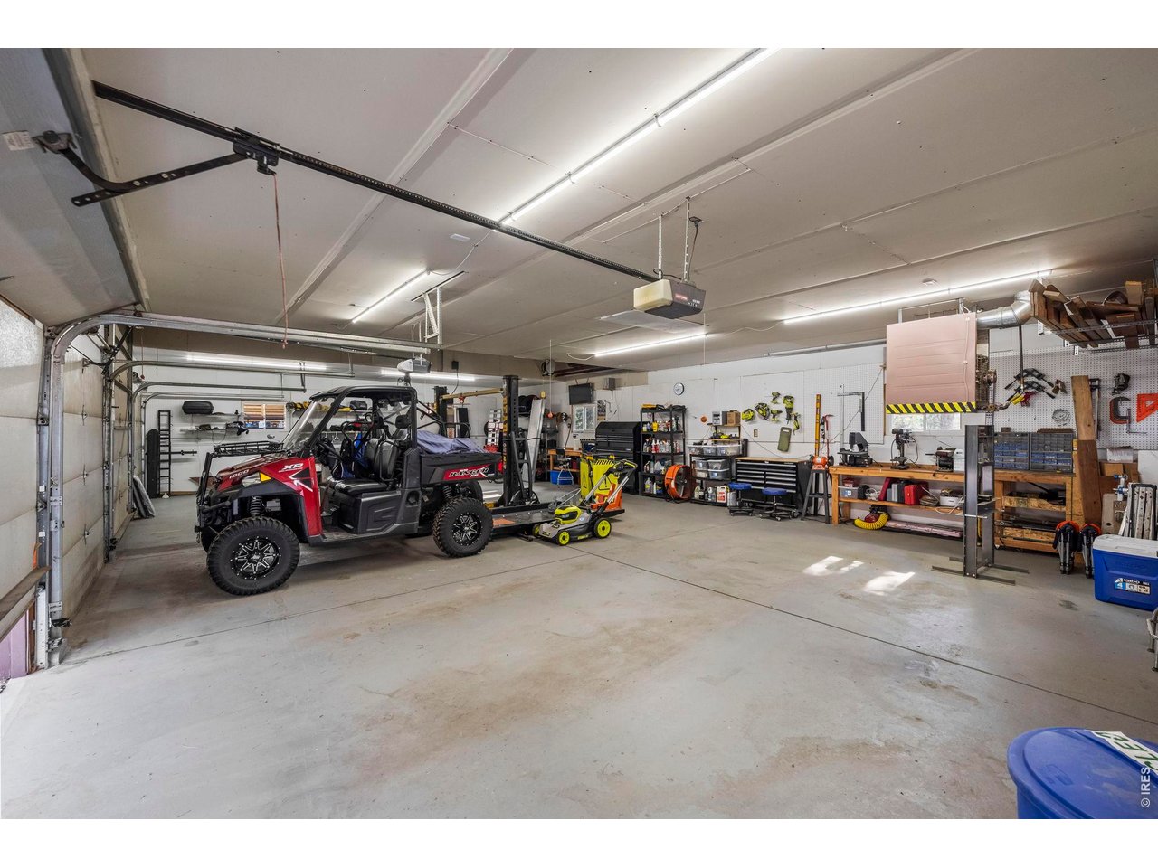 8701 Rock Hill Road Loveland, CO 80537 - Photo 6 of 50 a view of a garage with a bike and car