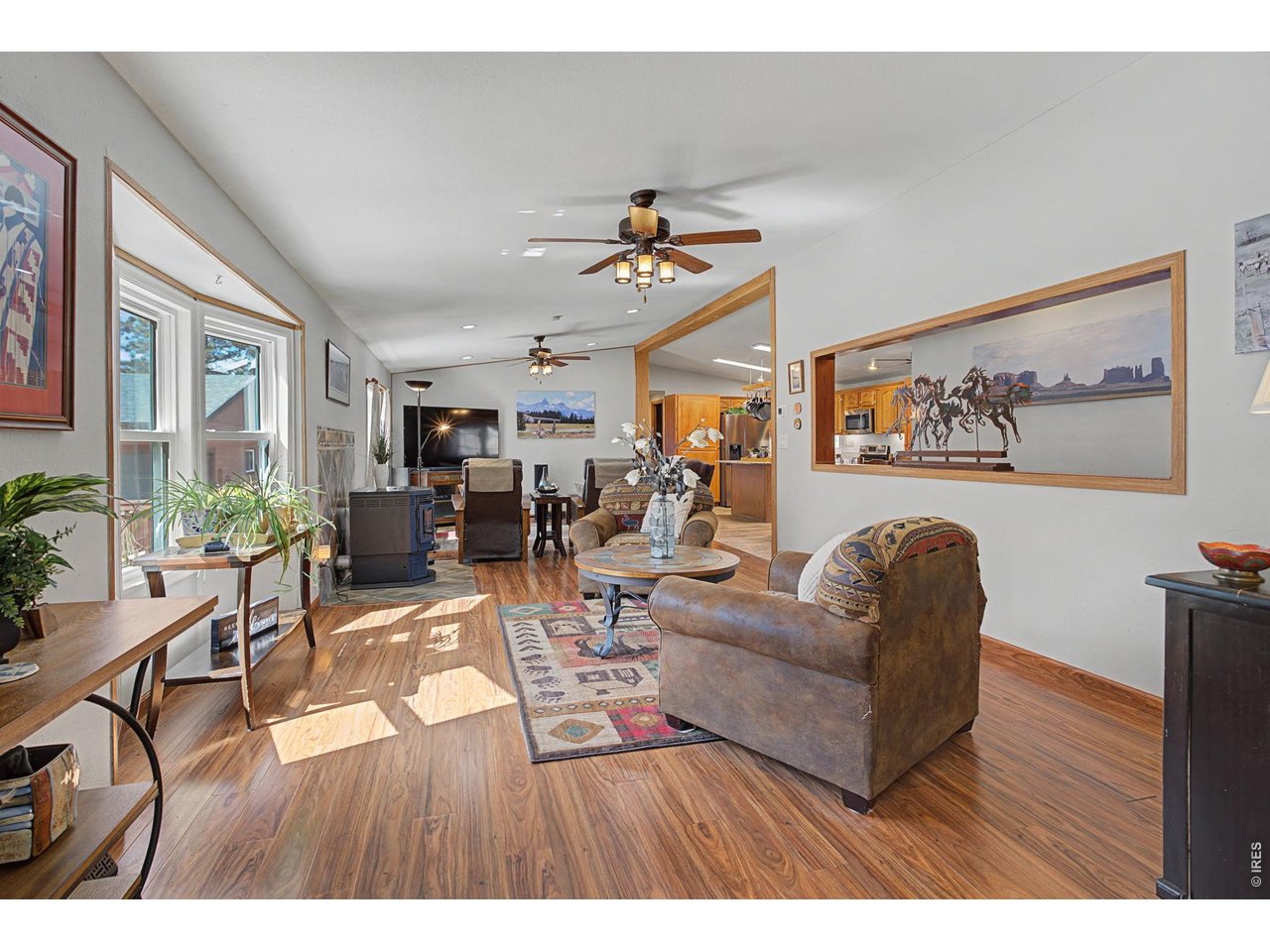 8701 Rock Hill Road Loveland, CO 80537 - Photo 7 of 50 a living room with furniture and wooden floor