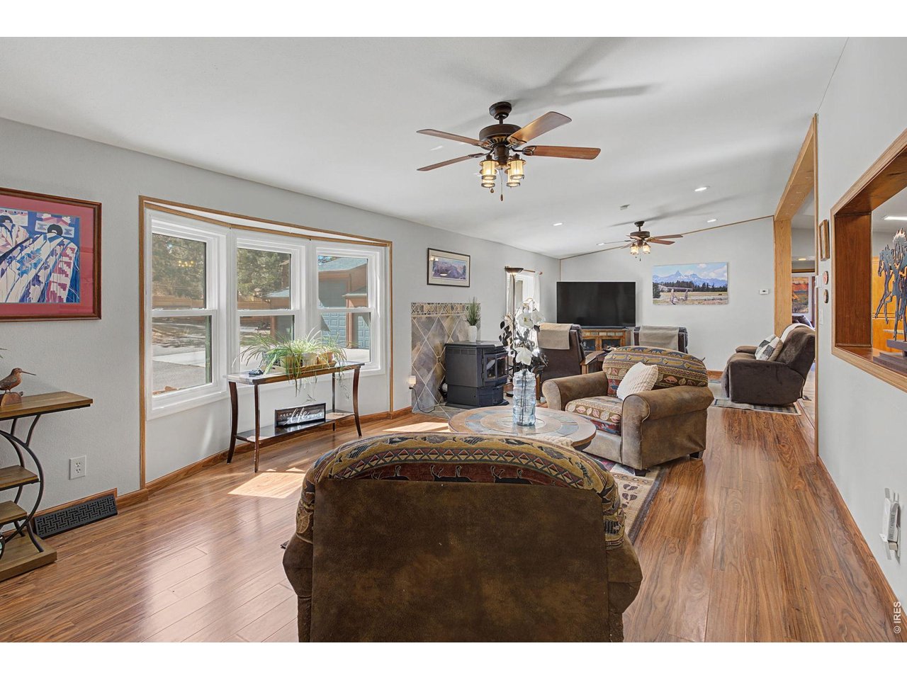 8701 Rock Hill Road Loveland, CO 80537 - Photo 8 of 50 a living room with furniture and a wooden floor
