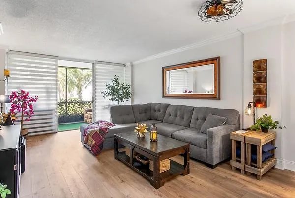 a living room with furniture and a large window