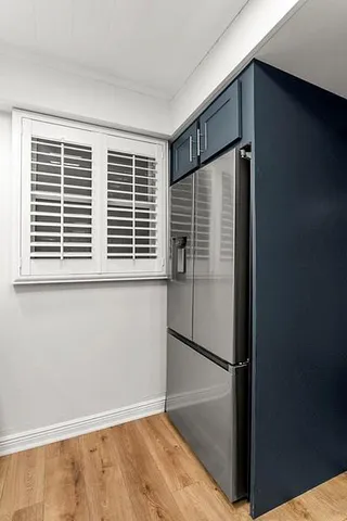 a view of a tree in front of a house