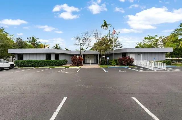 a view of a livingroom with furniture and staircase