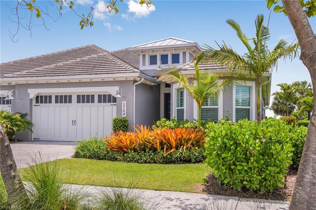 8777 Yucatan Court Naples, FL 34113 - Photo 1 of 41 a front view of a house with a garden