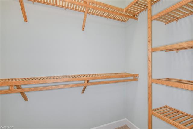 8777 Yucatan Court Naples, FL 34113 - Photo 17 of 41 a view of a room with racks on the wall
