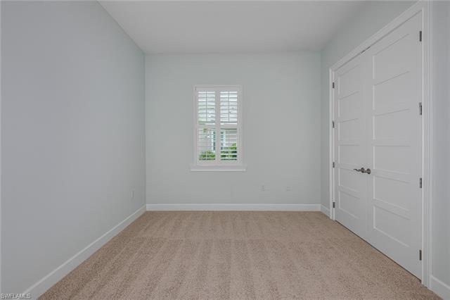 8777 Yucatan Court Naples, FL 34113 - Photo 22 of 41 a view of an empty room with a window