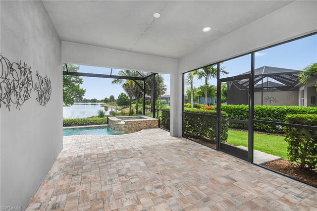 8777 Yucatan Court Naples, FL 34113 - Photo 26 of 41 a view of a porch with garden