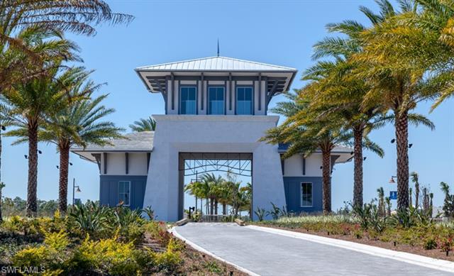 8777 Yucatan Court Naples, FL 34113 - Photo 31 of 41 a front view of a house with a garden