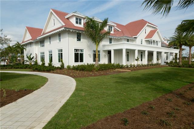 8777 Yucatan Court Naples, FL 34113 - Photo 36 of 41 a front view of a house with a garden