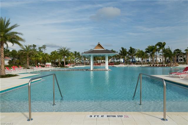 8777 Yucatan Court Naples, FL 34113 - Photo 38 of 41 a swimming pool with outdoor seating and yard