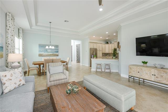 8777 Yucatan Court Naples, FL 34113 - Photo 8 of 41 a living room with furniture and a flat screen tv