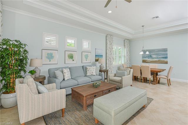 8777 Yucatan Court Naples, FL 34113 - Photo 9 of 41 a living room with furniture and a potted plant