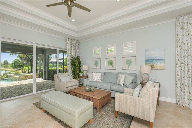 8777 Yucatan Court Naples, FL 34113 - Photo 10 of 41 a living room with furniture and a large window