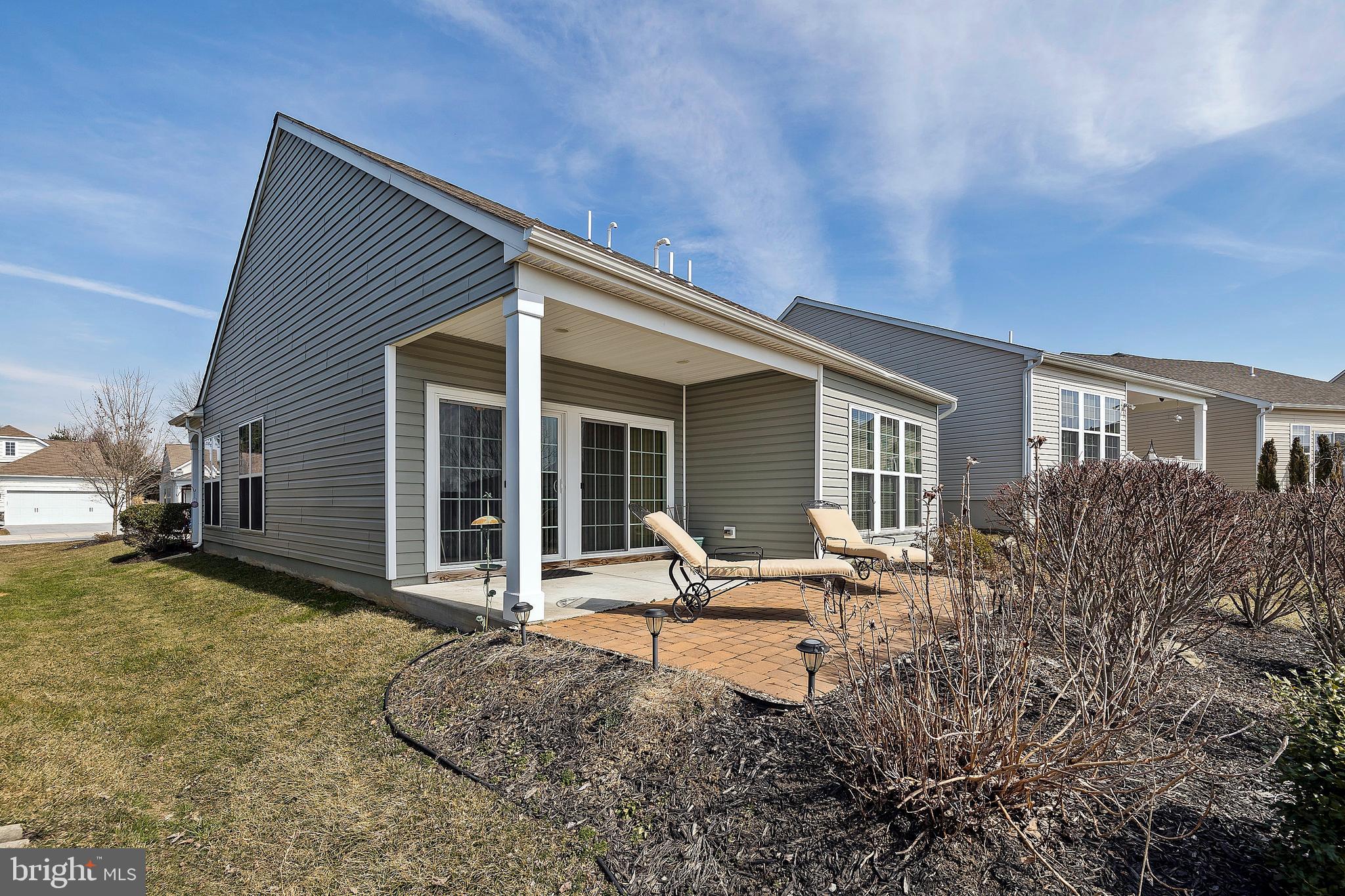580 Prizer Court Downingtown, PA 19335 - Photo 3 of 37 Back Covered Patio with Extended Brick Pavers
